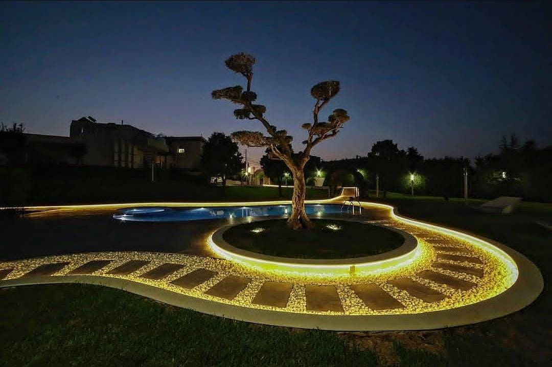 Illuminated landscape and pool by AMD